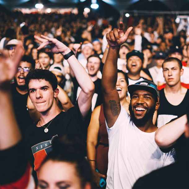 A diverse crowd at a live event.